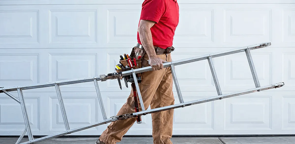 Garage door repair technician arriving with tools and ladder in Hollywood, FL