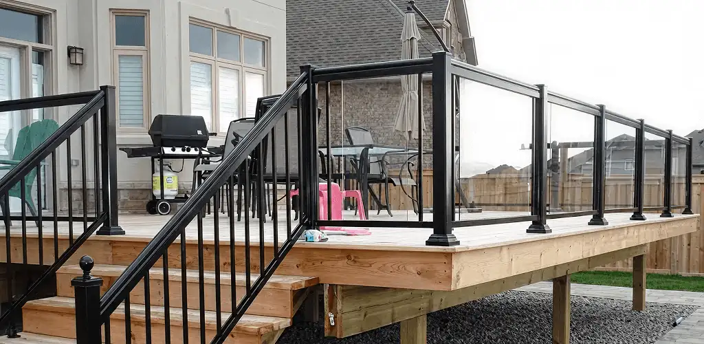 Handrail installation on a deck staircase for safety and code compliance in Hollywood, FL